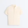 Cămășă de polo cu mâneci scurte din tricot ajurat Cămășă de polo cu mâneci scurte din tricot ajurat
