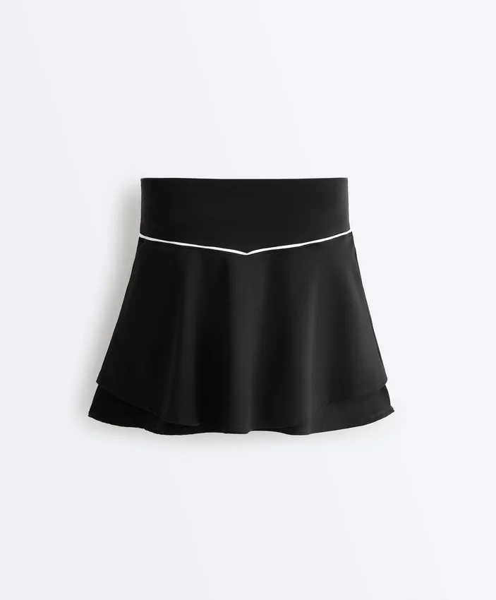 Fustă scurtă de pantaloni, cu două straturi Fustă scurtă de pantaloni, cu două straturi