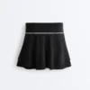 Fustă scurtă de pantaloni, cu două straturi Fustă scurtă de pantaloni, cu două straturi
