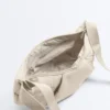 Gență matlasată cu curea transversală Gență matlasată cu curea transversală