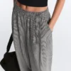 Pantaloni balon din amestec de lyocell cu imprimeu gingham Pantaloni balon din amestec de lyocell cu imprimeu gingham