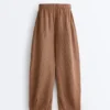 Pantaloni balon din in 100% cu imprimeu în dungi Pantaloni balon din in 100% cu imprimeu în dungi