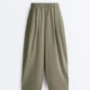 Pantaloni conici plisați din bumbac 100% Pantaloni conici plisați din bumbac 100%