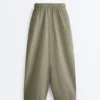 Pantaloni conici plisați din bumbac 100% Pantaloni conici plisați din bumbac 100%