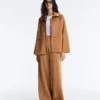 Pantaloni cu talie înaltă și croi larg, cu efect de neopren Pantaloni cu talie înaltă și croi larg, cu efect de neopren