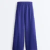 Pantaloni largi din 100% in, cu pli lateral