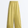 Pantaloni largi din 100% in, cu pli lateral