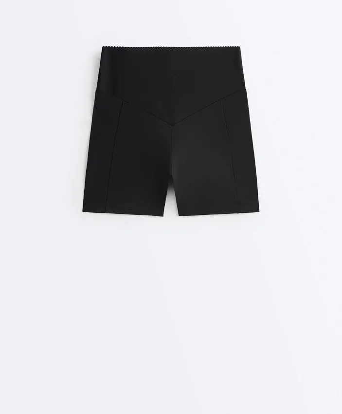 Pantaloni scurți de 10 cm cu talie înaltă și buzunar compresiv Pantaloni scurți de 10 cm cu talie înaltă și buzunar compresiv