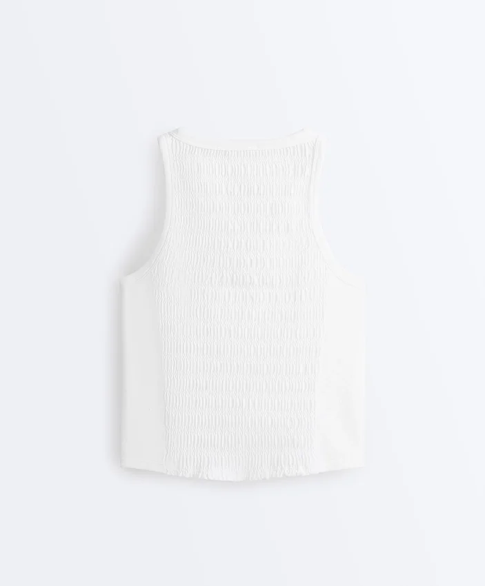 Tricou fără mâneci, fără cusături, cu smocuri Tricou fără mâneci, fără cusături, cu smocuri